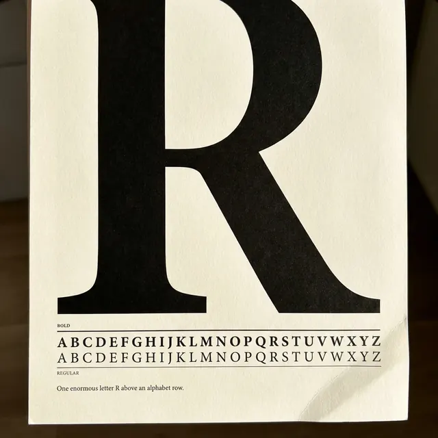 [object Object] — A typeface shown off — one huge letter, the alphabet beneath.